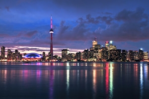 Toronto skyline at night from the water.