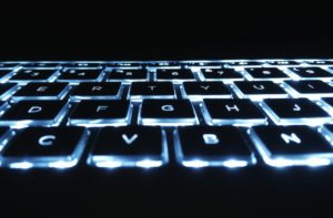 Computer keyboard representing keyboard shortcuts for strikethrough in Microsoft word.