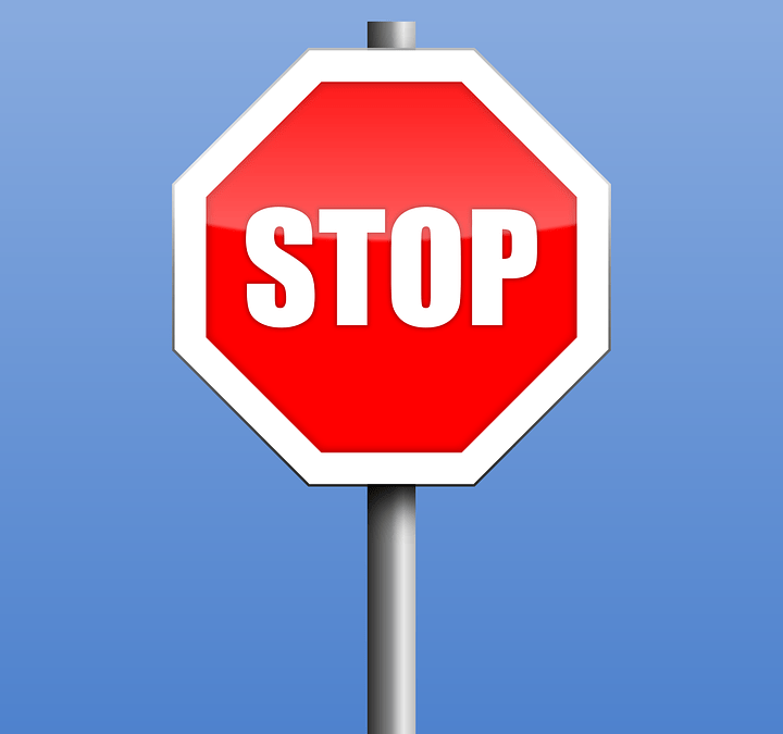 Stop Word changing formatting automatically by turning off autoformat options represented by a stop sign.
