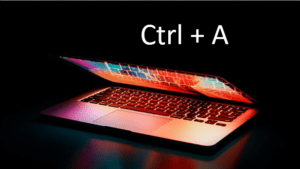 Select all in Word represented by a laptop with a keyboard shortcut.