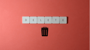 Delete a table in Word represented by the word delete and a trash can.